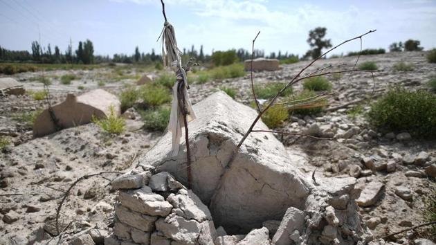 A view of a traditional Uighur cemetery before it was destroyed in Shayar, Xinjiang. China is destroying burial grounds where generations of Uighur families have been laid to rest, leaving behind human bones and broken tombs in what activists call an effort to eradicate the ethnic group’s identity in Xinjiang. (Hector Retamal / AFP)