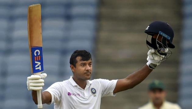 Pune: Indian cricketer Mayank Agarwal raises his bat after scoring a century.(PTI)