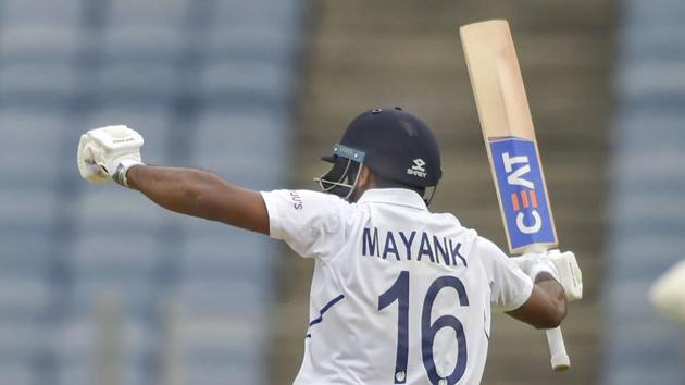 Pune: Indian cricketer Mayank Agarwal raises his bat after scoring a century. (PTI) Pune: Indian cricketer Mayank Agarwal raises his bat after scoring a century. (PTI)