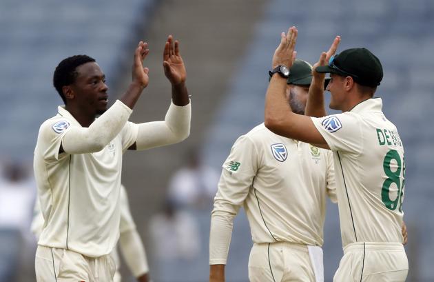 South Africa's Kagiso Rabada, left, celebrates with teammates the dismissal of India's Mayank Agarwal during the second cricket test match between India and South Africa in Pune. (AP)
