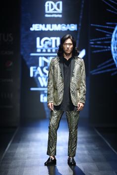 A model walks for Jenjum Gadi, known for its fresh design using tribal colours, motifs art and culture. 