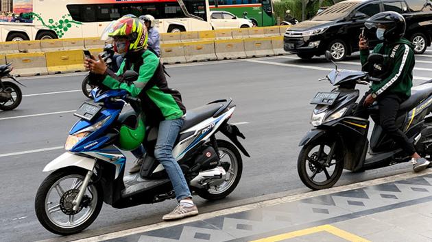 Bike taxis are a popular and inexpensive way to negotiate Jakarta’s busy traffic(Sarit Ray)