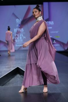 PURPLE FEATHERS by Pinkey represents royalty and creativity through its collection. The inspiration of the drapes have been derived from our vintage sarees for the contemporary woman of today with its timeless style cuts. 