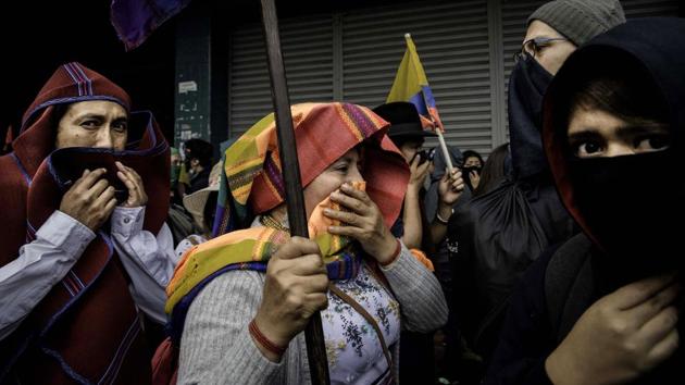 On October 5 major roads around the country are blocked by farmers, accompanied by indigenous people -- an influential group that makes up a quarter of the population. The government announced the first death the following day, saying a man was run over at a protest in the south. (Johis Alarcon / Bloomberg)