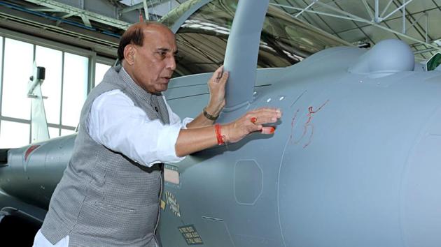 Defence Minister Rajnath Singh performed a Shastra Puja on Rafale combat aircraft.(ANI Photo) Indian Navy