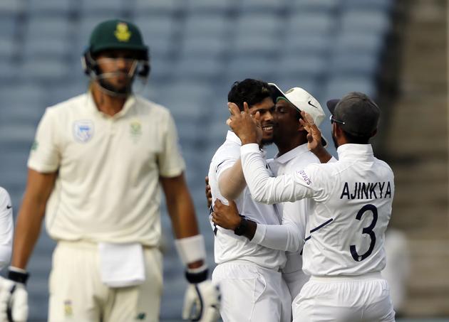 Indian cricketer Umesh Yadav, without cap, celebrates after dismissing South Africa's Aiden Markram during the second day of the second cricket test match between India and South Africa in Pune. (AP)