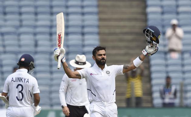 Pune: Indian cricket team Captain Virat Kohli raises his bat after scoring a century on the day 2 of second India-South Africa cricket test match, at Maharashtra Cricket Association Stadium in Pune. (PTI)