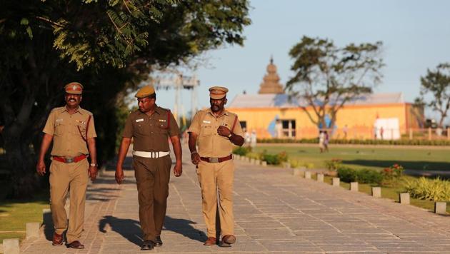 Policemen patrol inside the premises of Shore temple a day before the visit of Chinese President Xi Jinping in Mamallapuram on the outskirts of Chennai.(REUTERS)