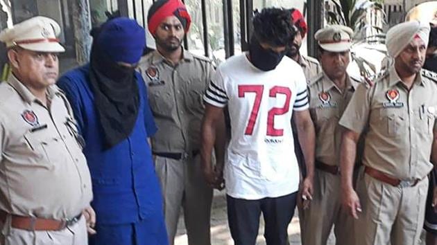 Gangster Sukhwinder Singh alias Soni alias Boxer and his three accomplices in police custody in Ludhiana on Friday.(HT PHOTO)