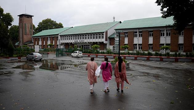 Jammu and Kashmir: Teachers enter school in Srinagar on Monday. (ANI Photo) Jammu and Kashmir: Teachers enter school in Srinagar on Monday. (ANI Photo)