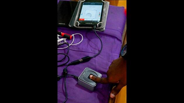 A TB patient marks his attendance before getting his daily dose of medicine at a DOTS centre. Transmitted by droplets of saliva when a contaminated person speaks or coughs, TB spreads easily in crowded cities, where immune systems are often already weakened by air pollution or poor sanitary conditions. The bacterium mainly attacks the men who make up much of the workforce, with the death or incapacitation of a breadwinner piling additional misery on families. (Money Sharma / AFP)