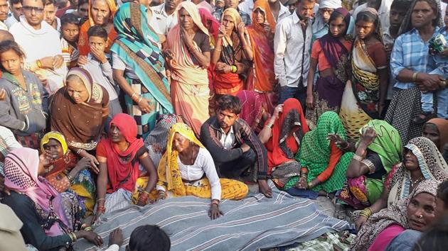 Bulandshahr: Family members mourn after their relatives were killed when a bus rammed into a group of pilgrims who were on their way back from the Vaishno Devi shrine and were sleeping on the roadside, in Bulandshahr, Friday, Oct 11, 2019. The seven victims, including three children, were residents of Chandpa in Hathras district. (PTI) Bulandshahr: Family members mourn after their relatives were killed when a bus rammed into a group of pilgrims who were on their way back from the Vaishno Devi shrine and were sleeping on the roadside, in Bulandshahr, Friday, Oct 11, 2019. The seven victims, including three children, were residents of Chandpa in Hathras district. (PTI)