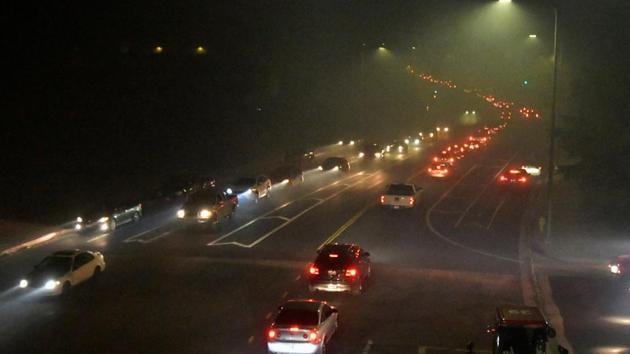 Local people evacuate themselves during the wind-driven wildfire in Sylmar, California. (Reuters Photo) Local people evacuate themselves during the wind-driven wildfire in Sylmar, California. (Reuters Photo)