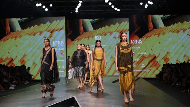 Models walk the ramp showcasing fashion designer designers Rahul Anand and Anushka Laul on the third day of LMIFW. Their collection was inspired by the empowered woman, and BJP’s Shazia Ilmi played showstopper for the designer duo. (IANS)