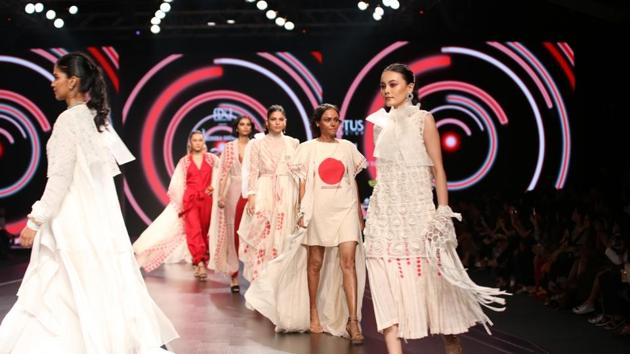 Models walk the ramp showcasing fashion designer Nidhika Shekhar's creations on the third day of LMIFW. The first outfit of the show was a white asymmetrical dress, which the designer said represented a girl before hitting puberty. (IANS)