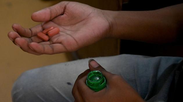 A patient holds his daily dose of medicine at a DOTS centre. The government of Narendra Modi, which came to power promising development for the nation’s 1.3 billion people, has set an ambitious target of overcoming India’s TB “epidemic” -- the world’s largest -- by 2025. It has created new patient monitoring systems and recently enlisted artificial intelligence to help screen for the disease. (Money Sharma / AFP)
