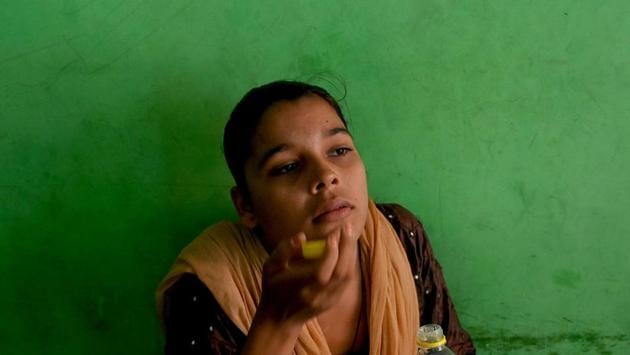 A patient consumes her daily dose of medicine at a DOTS centre. “TB continues to be predominantly a poor man’s disease,” said Shibu Vijayan, Global TB Technical Director at PATH, an NGO. Poorly administered anti-TB drugs or treatments interrupted before their term are a major worry for health workers, and responsible for the spread of multidrug-resistant strains of the disease. (Money Sharma / AFP)