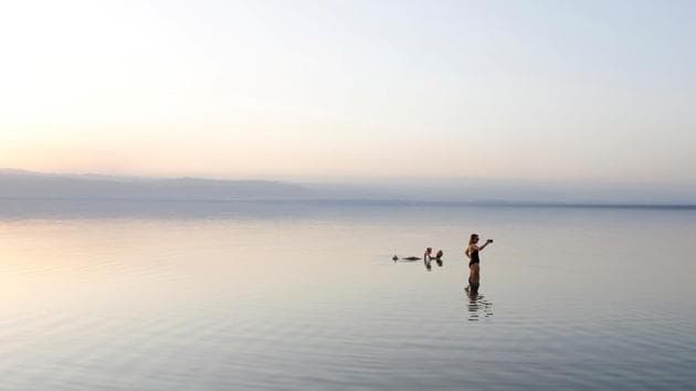 People take a swim on the shores of the Dead Sea near Amman, Jordan. (Youssef Boudlal / REUTERS)