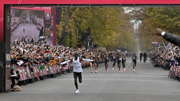 Kenya's Eliud Kipchoge celebrates as he crosses the finish line at the end of his attempt to bust the mythical two-hour barrier for the marathon in Vienna, Austria. Kipchoge holds the men's world record for the distance with a time of 2hr 01min 39sec, which he set in the flat Berlin marathon on September 16, 2018. He tried in May 2017 to break the two-hour barrier, running on the Monza National Autodrome racing circuit in Italy, failing narrowly in 2hr 00min 25sec. (Herbert Neubauer / AFP)