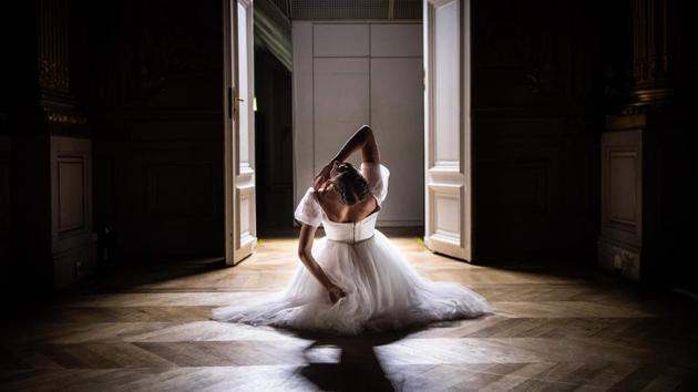 A dancer of the Paris Opera Ballet performs during the dancing show "Degas Danse" on the sidelines of the exhibition "Degas at the Opera" at the Orsay museum in Paris, France. (Martin Bureau / AFP)