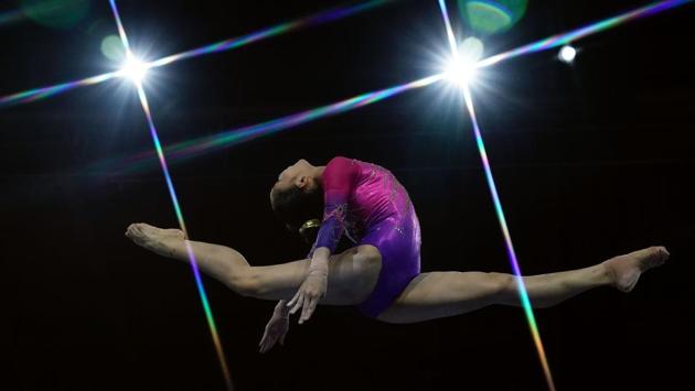 China's Tang Xijing performs on the balance beam during the women's all-around final at the FIG Artistic Gymnastics World Championships at the Hanns-Martin-Schleyer-Halle in Stuttgart, southern Germany. (Lionel Bonaventure / AFP)