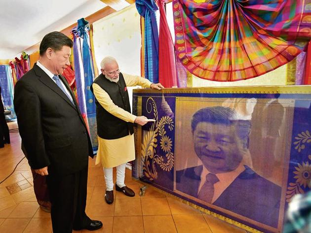 PM Narendra Modi with Chinese President Xi Jinping in Kovalam near Mamallapuram on Saturday. (PTI) PM Narendra Modi with Chinese President Xi Jinping in Kovalam near Mamallapuram on Saturday. (PTI)