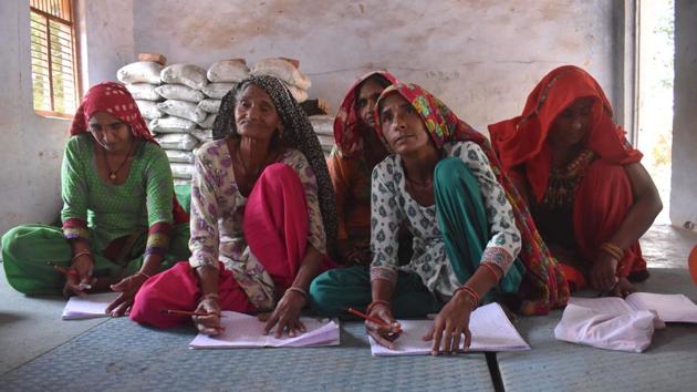 Elderly women at a primary government school in Bar Gujjar village located near New Manesar Police Line, in Gurugram, Haryana. The school had received two shut down notices in the past citing less than 50 students. However, the school has now been turned around with active volunteering from residents of a condominium in the city. The school now has 55 students, CCTV cameras, water purifier and other amenities. (Yogesh Kumar / HT Photo)
