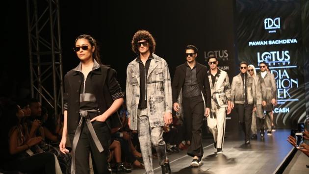 Models walk the ramp showcasing the creations of fashion designer Pawan Sachdeva. (IANS)