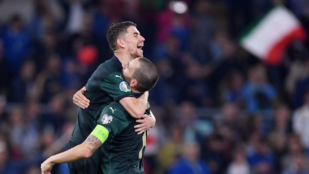 Italy's Jorginho celebrates with Leonardo Bonucci at the end of the match(REUTERS)