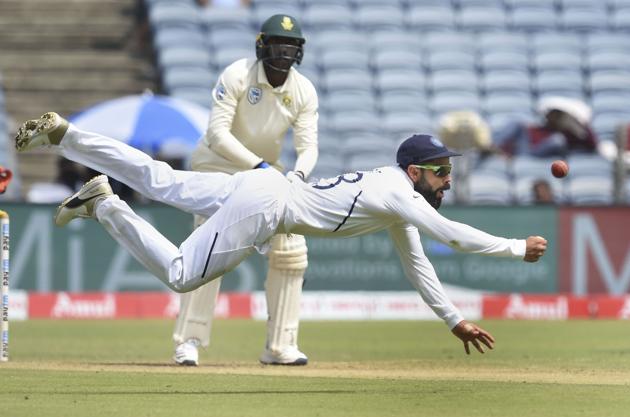 Indian cricket team captain Virat Kohli dives to take a catch. (PTI)