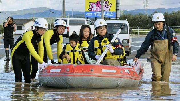 Residents on a rubber boat are rescued as they were stranded in Iwaki, Fukushima prefecture. More than 100,000 rescuers, including 31,000 troops, were working into the night to reach people trapped after torrential rain caused landslides and filled rivers until they burst their banks. In Fukushima, Tokyo Electric Power Co reported irregular readings from sensors monitoring water in its Fukushima Daiichi nuclear plant. The plant was crippled by a 2011 earthquake and tsunami. (AP)