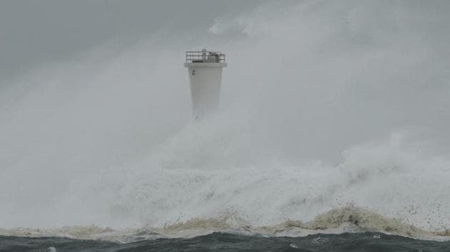 Surging waves hit against the breakwater and a lighthouse as Typhoon Hagibis approaches at a port in town of Kiho, Mie prefecture, central Japan on Saturday. Hagibis, which means “speed” in the Philippine language Tagalog, made landfall on Japan’s main island of Honshu on Saturday evening and headed out to sea early on Sunday, leaving behind cloudless skies and high temperatures across the country. (Toru Hanai / AP)