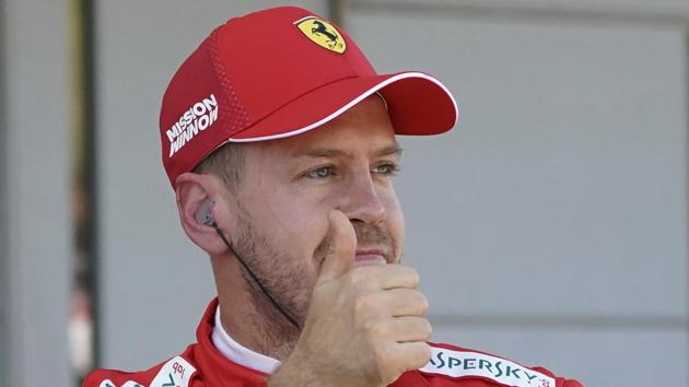 Ferrari driver Sebastian Vettel of Germany shows a thumbs-up.(AP) Ferrari driver Sebastian Vettel of Germany shows a thumbs-up.(AP)