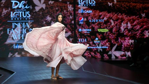 A model showcases a creation by designer Dhi during the FDCI Lotus Make-up India Fashion Week Spring Summer 2020, organised by FDCI at Major Dhyan Chand National Stadium in New Delhi. (Amal KS / HT Photo)