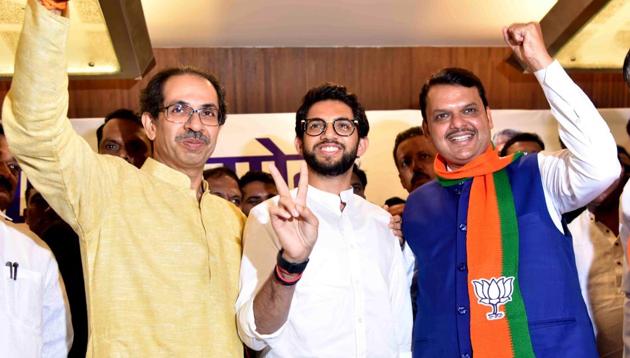 Shiv Sena chief Uddhav Thackeray, party leader Aaditya Thackeray and Maharashtra CM Devendra Fadnavis.(PTI File Photo)