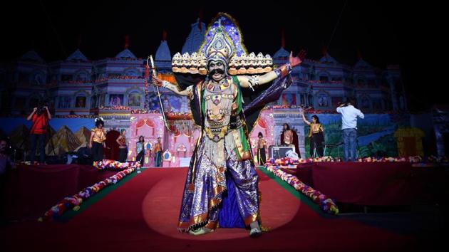 An artist plays the character of Ravana during Ramlila on the eve of Dusshera, at Ajmal Khan Park, Karol Bagh, in New Delhi. (Sanchit Khanna / HT Photo)