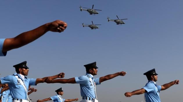 Indian Air Force (IAF) soldiers march as advanced light helicopters fly during the Indian Air Force Day celebrations at the Hindon Air Force Station on the outskirts of New Delhi. (Anushree Fadnavis / REUTERS)
