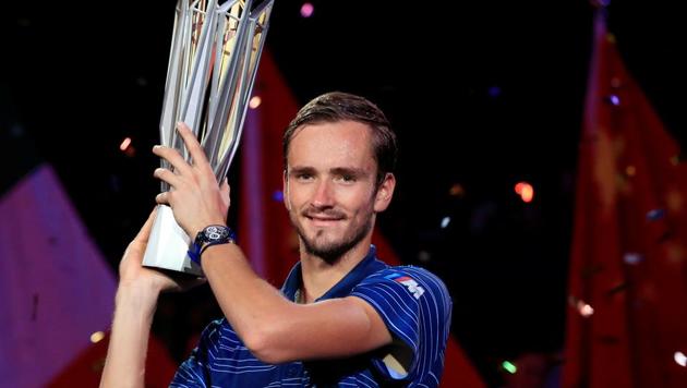 Daniil Medvedev of Russia celebrates winning Shanghai Masters with his trophy.(REUTERS)