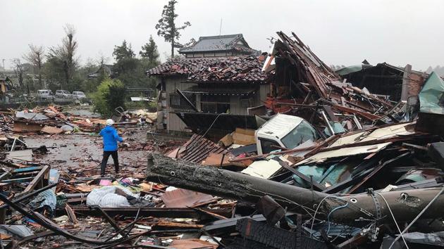 Damaged houses caused by weather patterns from Typhoon Hagibis are seen in Ichihara, Chiba prefecture. The typhoon claimed its first victim yesterday even before making landfall, as potentially record-breaking rains and high winds sparked evacuation orders for more than a million people. Landslides and flooding claimed more lives overnight, and the toll climbed higher after sunrise on Sunday, as the scale of the devastation wrought by Hagibis became clear. (AFP)
