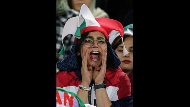 A woman cheers ahead of the World Cup Qatar 2022 Group C qualification match with Cambodia. Iranian state television, long controlled by hard-liners, aired footage of women cheering, and commentators even acknowledged their presence. “There can be no stopping or turning back now,” FIFA President Gianni Infantino said in a statement. “History teaches us that progress comes in stages, and this is just the beginning of a journey.” (Atta Kenare / AFP) A woman cheers ahead of the World Cup Qatar 2022 Group C qualification match with Cambodia. Iranian state television, long controlled by hard-liners, aired footage of women cheering, and commentators even acknowledged their presence. “There can be no stopping or turning back now,” FIFA President Gianni Infantino said in a statement. “History teaches us that progress comes in stages, and this is just the beginning of a journey.” (Atta Kenare / AFP)