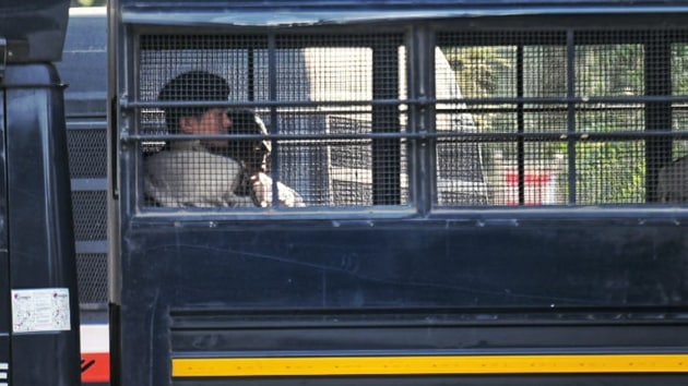 Former Finance Minister and Senior Congress leader P Chidambaram sits inside a police vehicle as he is brought for hearing at Rouse Avenue District court in New Delhi.(Photo: Amal KS/ Hindustan Times)