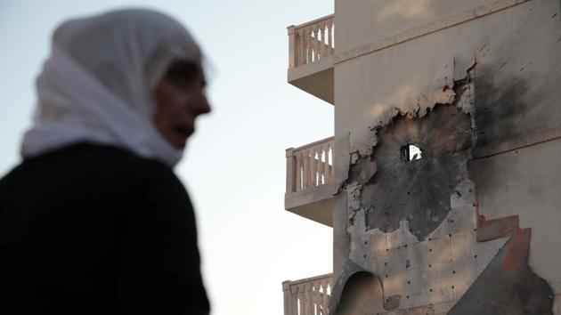 An apartment building is damaged by a rocket fired from Syria, in Nusaybin, Turkey. Turkish forces shelled targets near Ral al Ain and Kurdish-led Syrian Democratic Forces (SDF) fighters responded, a witness said. The Turkish military hit 181 targets of the Kurdish militia with its air force and artillery since the start of operation. One of the prisons where ISIS detainees were held was also struck by a Turkish air strike, the SDF said. (Sertac Kayar / REUTERS)