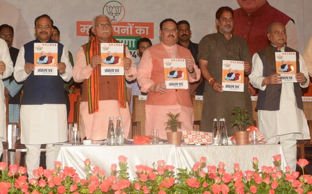 BJP leaders JP Nadda and Haryana Chief Minister Manohar Lal Khattar release the party’s manifesto ahead of Haryana Assembly elections at The Lalit Hotel in Chandigarh. (Photo by Anil Dayal/Hindustan Times) BJP leaders JP Nadda and Haryana Chief Minister Manohar Lal Khattar release the party’s manifesto ahead of Haryana Assembly elections at The Lalit Hotel in Chandigarh. (Photo by Anil Dayal/Hindustan Times)