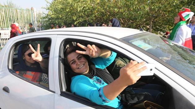 Women show the victory sign as they arrive for the match. Women have been banned from many sporting events in Iran since 1981, during the early years of the country’s Islamic Revolution. Iran is the world’s last nation to bar women from soccer matches. Saudi Arabia recently began letting women see games. (Atta Kenare / AFP) Women show the victory sign as they arrive for the match. Women have been banned from many sporting events in Iran since 1981, during the early years of the country’s Islamic Revolution. Iran is the world’s last nation to bar women from soccer matches. Saudi Arabia recently began letting women see games. (Atta Kenare / AFP)