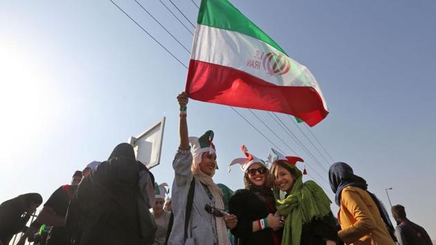 As one woman shouted from a passing minibus before the match: “We are here finally!” So far, Iran’s hard-line Islamic theocracy is not willing to go as far some women would like. Authorities announced they will allow women to attend only international soccer matches. (Atta Kenare / AFP) As one woman shouted from a passing minibus before the match: “We are here finally!” So far, Iran’s hard-line Islamic theocracy is not willing to go as far some women would like. Authorities announced they will allow women to attend only international soccer matches. (Atta Kenare / AFP)
