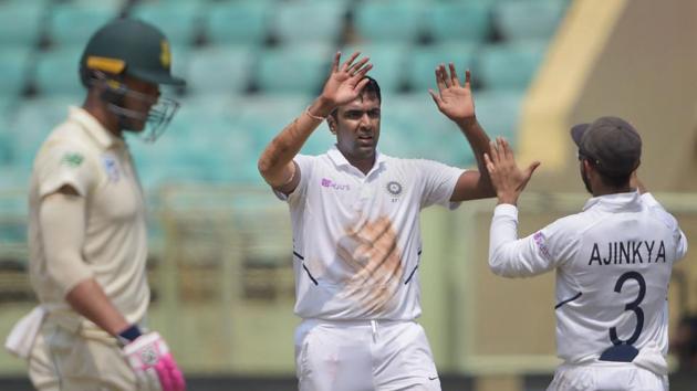 Ravichandran Ashwin celebrates with teammate Ajinkya Rahane during the 1st test match against South Africa in Visakhapatnam.(PTI)