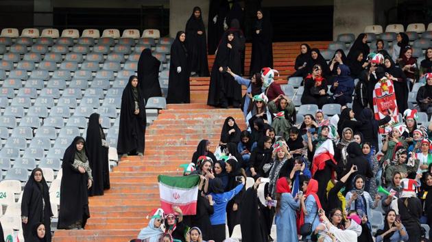 Under pressure from FIFA, Iran let a carefully controlled number of women into the stadium, allocating them 4,000 tickets in a venue that seats about 80,000 people, and arranged for 150 female security personnel in black chadors to watch them. They sat at least 200 meters from the few thousand men at the match. (Atta Kenare / AFP) Under pressure from FIFA, Iran let a carefully controlled number of women into the stadium, allocating them 4,000 tickets in a venue that seats about 80,000 people, and arranged for 150 female security personnel in black chadors to watch them. They sat at least 200 meters from the few thousand men at the match. (Atta Kenare / AFP)
