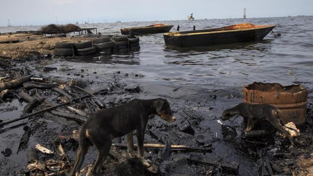 “We should be afraid,” said fisherman Simon Bolivar, named for Venezuela’s heroic founding father. “If we don’t go fishing, we won’t catch anything. Then, what will eat? No one’s going to come and rescue us.” (Rodrigo Abd / AP)
