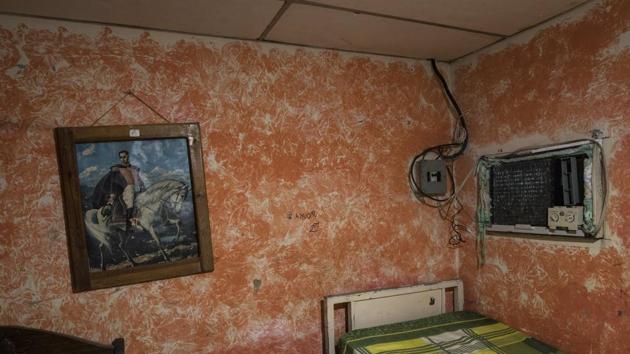 A painting of Venezuelan national hero Simon Bolivar hangs in a bedroom at the home of Rodríguez in Cabimas, the epicenter of Venezuela’s oil industry and once known as “Venezuela’s Saudi Arabia.” The oil production crashed to one-fifth of its all-time high two decades ago. Critics blame the socialist revolution launched by the late President Hugo Chavez while current President Nicolás Maduro, accuses the “imperialist” US of leading an economic war bent on destroying his socialist nation. (Rodrigo Abd / AP)