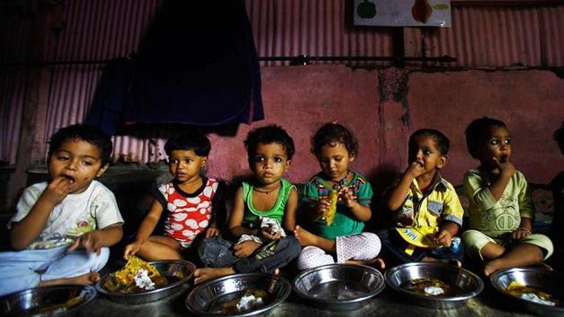 World Food Day 2019: Malnourished children eat at Apanalaya, Mumbai, an organisation working for the betterment of slum children.(AP)